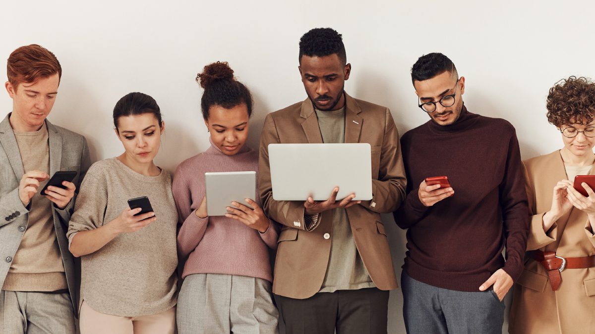 People checking mobile and desktop devices