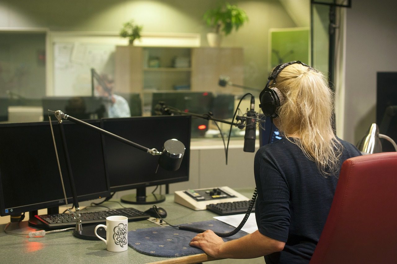 Woman inside a radio booth