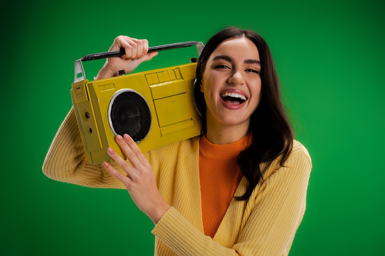 woman holding a radio